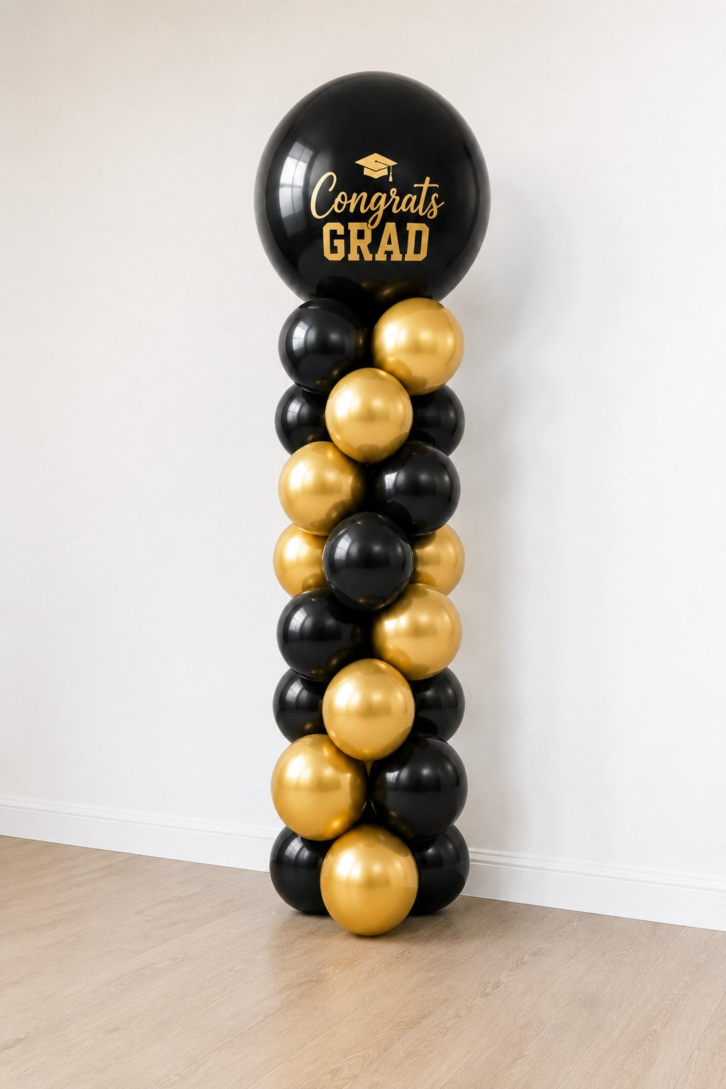 Spiral Graduation tower/column with gold and black balloons in Ottawa Gatineau delivery